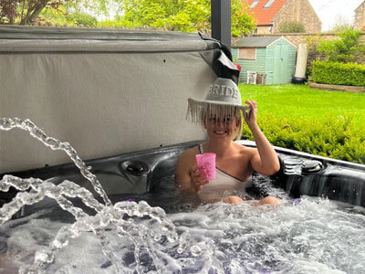 A bride-to-be enjoying a soak in a hot tub