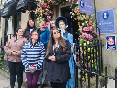 A group of hens posing with Jane Austen.