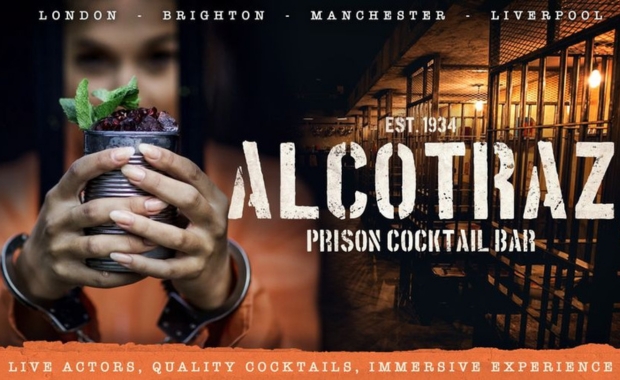 a person holds a cocktail next to an Alcotraz logo