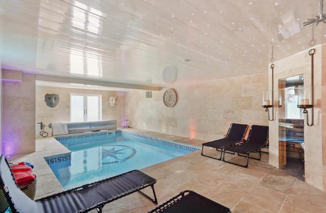 Luxury indoor swimming pool at Primrose Villa, a stylish Yorkshire hen party house with spa-style relaxation space.
